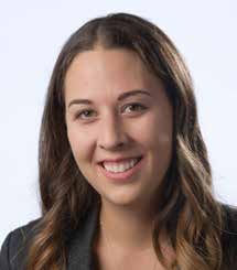 A headshot of Liz Simpson, Hybrid Product Development Lead for Bayer. They are a smiling Caucasian person with long brown hair.